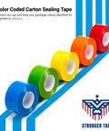 Color coded packing tape in blue, green, yellow, orange, and red rolls for clear package identification.