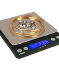 Platinum XP500 Pro Grade Jeweler Pocket Scale for Quick Gold and Silver Weighing, displaying gold jewelry, 500g x 0.01g readout, silver finish.