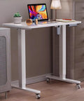 White Adjustable Standing Desk With Flip Top Tiltable Workstation And Three Memory Height Settings For Home Office with laptop and notepad.