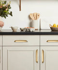 Champagne Bronze Cup Pulls 3 Inch Center To Center 10 Pack Zinc Alloy Cabinet And Drawer Handles in kitchen setting