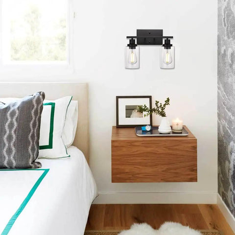 Industrial Two Light Black Wall Sconce with Clear Glass Shade and Metal Base for Bathroom Vanity and Hallway Lighting above nightstand