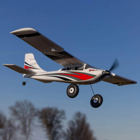 RC Airplane Apprentice STOL S 700 RTF With AS3X SAFE Technology flying in blue sky, featuring red and white color scheme.