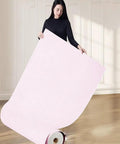 Woman holding Super Solid 5Mm Self Adhesive Thermal Wallpaper With Ixpe Insulation and Realistic 3d Linen Texture Easy Peel Stick Wall Covering To Kick Up Your Bedroom Or Bath Space Pink Roll.