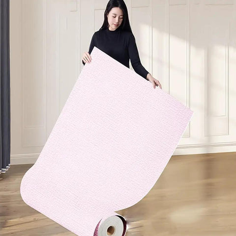 Woman holding Super Solid 5Mm Self Adhesive Thermal Wallpaper With Ixpe Insulation and Realistic 3d Linen Texture Easy Peel Stick Wall Covering To Kick Up Your Bedroom Or Bath Space Pink Roll.