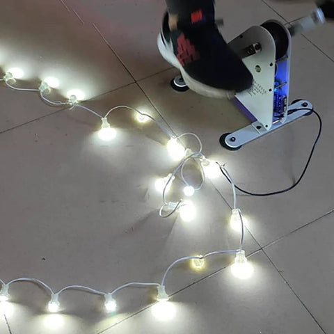 Pedal Powered Exercise Generator For Home Gym Workouts And Emergency Outages Featuring dual USB ports powering LED lights during use.