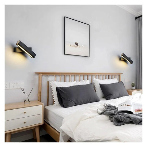 Elevate Your Home Vibe With This Sleek Black Metal Swivel Wall Sconce Led Lighting For Bedroom Living Room And Hallways Rustproof Adjustable Accent Lamp beside a bed.