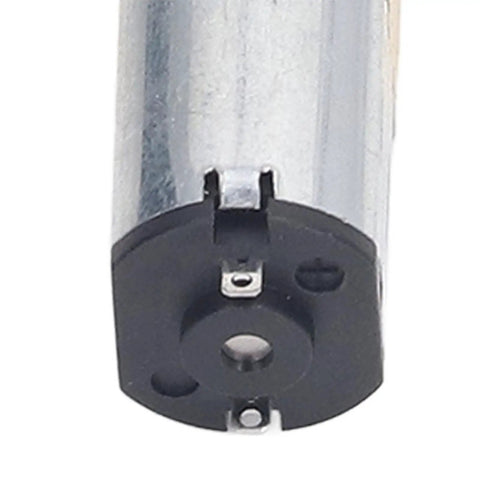 Close-up view of Heavy Hitter Brushed DC Gear Motor showing dual output shafts and steel casing details.