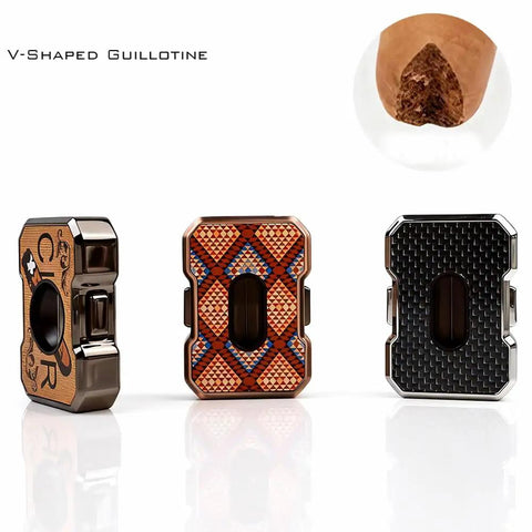 Set of three decorative cigar cutters with V-shaped guillotine design and unique patterns for stylish cigar trimming.