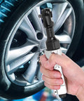 Wicked Smooth Aluminum Pneumatic Ratchet Wrench With A Quarter Inch Square Drive And 25 Ft Lbs Adjustable Torque Lever held near a car wheel.