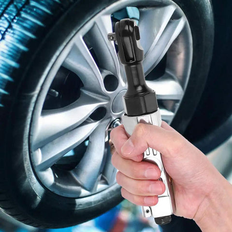 Wicked Smooth Aluminum Pneumatic Ratchet Wrench With A Quarter Inch Square Drive And 25 Ft Lbs Adjustable Torque Lever held near a car wheel.