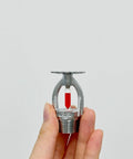 Heavy Duty Fire Sprinkler Head 1 Inch Dn25 Thread Automatic Heat Activation At 155F Pendent in hand for demonstration.