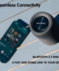 Compact Waterproof Portable Bluetooth Speaker That Goes Hard With Deep Bass, Dual Pairing, FM Radio, USB And AUX Input, 24 Hour Playtime viewed with a smartphone on a deck