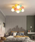 Colorful Globe 4 Light Modern Chandelier With Milk White Glass Shades Fun Globe Semi Flush Mount Lighting in a kids room.