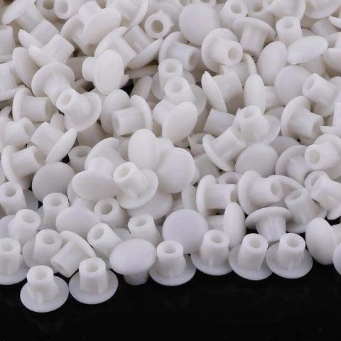 Must Have 1000 Pieces White Hinge Hole Plugs For Furniture And Home Improvement, Hole Covers for screws in a scattered view.