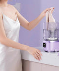 Woman using Game Changing Portable Mini Washing Machine Cordless Compact Laundry Spin Dryer for delicate fabrics.