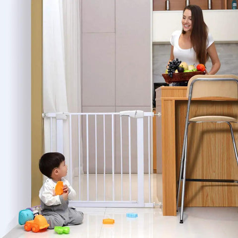 Heavy Duty Pet Safety Gate With Auto Close, extra tall and wide design, installed between kitchen and hallway, toddler playing nearby.