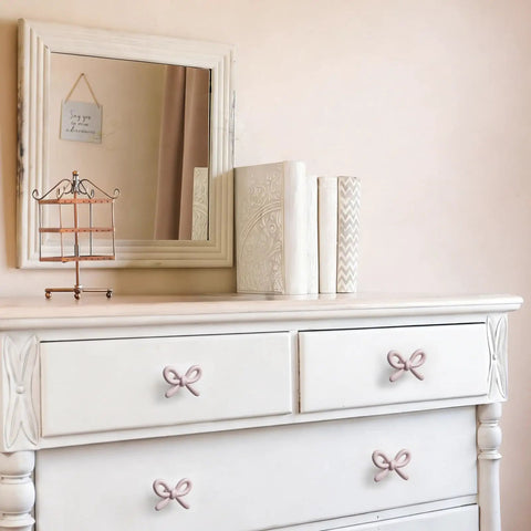 Snag These Premium Vintage Pink Bow Cabinet Knobs 6 Pack Farmhouse Traditional Solid Metal Drawer Pulls on white dresser.