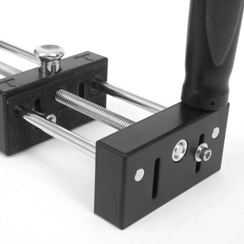 Side view of a Small Stock Holder for Router Tables with metal rods and black handle for securing tiny wood pieces during cutting.