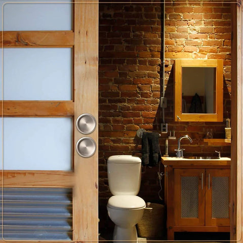 Satin Nickel Closet Door Finger Pull installed on sliding barn door in rustic bathroom