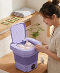No Hustle Foldable Washing Machine With Three Deep Clean Settings And Super Chill Spin Dry for delicate bras in purple mini washer.