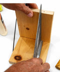 Hands holding a square wooden block with glue and metal tool visible; Fluted Birch Dowel Pins 100 Pack Half Inch By Two Inch Precision Milled For Furniture Joinery Cabinets Shelving Table Building Pro Grade Woodworking DIY Friendly featured in use.
