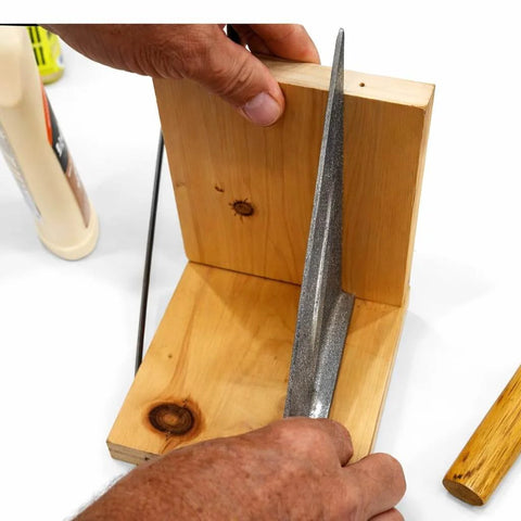 Hands holding a square wooden block with glue and metal tool visible; Fluted Birch Dowel Pins 100 Pack Half Inch By Two Inch Precision Milled For Furniture Joinery Cabinets Shelving Table Building Pro Grade Woodworking DIY Friendly featured in use.