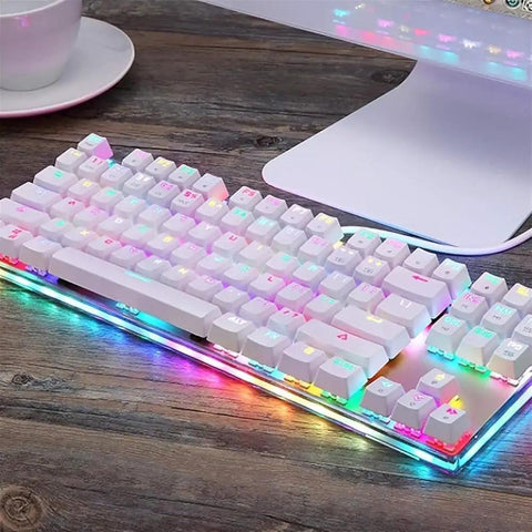 Wired Mechanical Gaming Keyboard With Slick Clicky Feel And Vivid RGB Backlight Built For PC Players Demanding Lightning Fast Typing Through Nine Flashing Light Designs To Straight Up Upgrade Your Entire Desk Setup on a wooden desk.