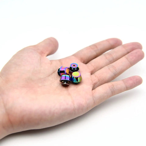 Kickass Gradient Purse Feet Hardware 4 Sets 1/2 Inch Metal Screw Back Rivet Studs in hand, colorful alloy fasteners for DIY projects.