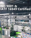 Industrial facility with ISO 9001 and IATF 16949 certification signage.