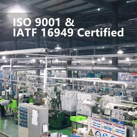 Industrial facility with ISO 9001 and IATF 16949 certification signage.