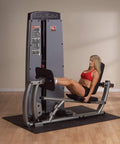 Woman using All In One Leg And Calf Press Machine with 210 lb weight stack for home gym leg press