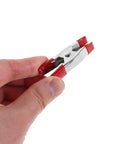 Super Sturdy 12 Piece Heavy Duty Metal Spring Clamps With Red Coated Jaws, Perfect For Woodworking Crafts Panel Fixing And DIY Household Projects That Rock. metal spring clamp held in hand