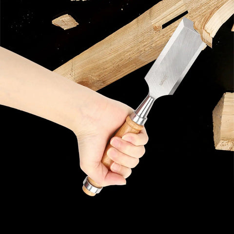 Pro Level Wood Chisel Set With Sturdy Wooden Handles And Razor Sharp Steel Blades held in hand for precise detailing on wood.