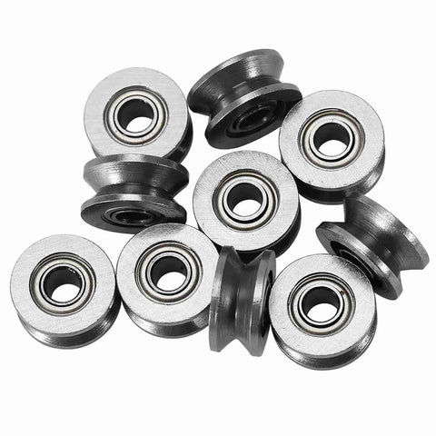 Ten pack of Double Sealed Carbon Steel V Groove Bearing And Pulley Wheel 4X13X6MM on a flat surface for linear motion systems.