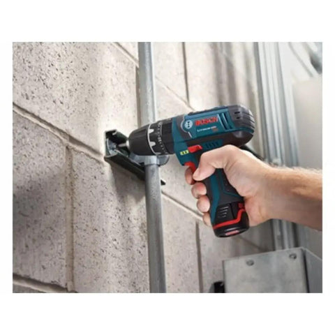 Ultra Compact 12V Max Hammer Drill And Driver Kit With 3/8 Inch Auto Chuck in use, drilling into concrete wall, lightweight design