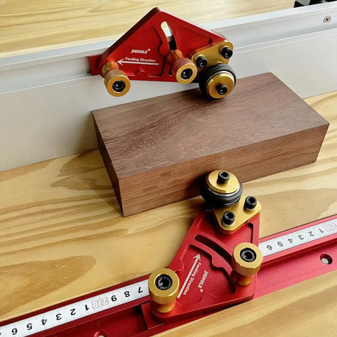 Pro Grade Portable Aluminum Table Saw Roller Feeder Dolly Featuring Smooth Ball Bearings For No Sweat Wide Lumber Pushing And Rock Solid Woodworking Safety Assist Stand on a wooden worktable with a piece of wood.