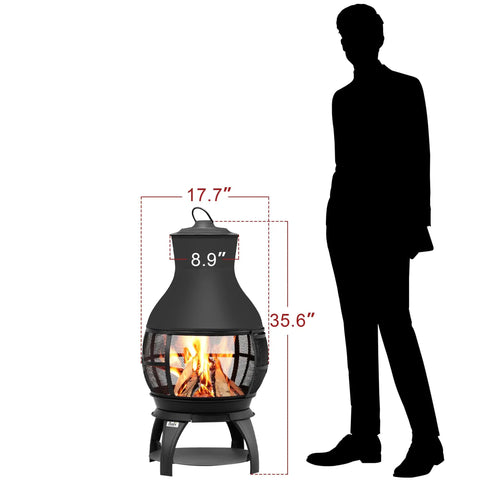 Compact Wood Burning Chiminea Fire Pit For Outdoors, Small Patio Outdoor Fireplace, 17.7 Inches Wide, 35.6 Inches Tall beside silhouette.