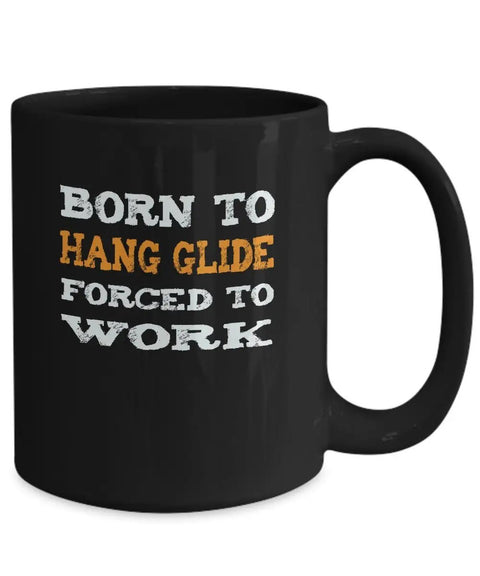 Black ceramic mug with "Born To Hang Glide Forced To Work" quote. Hang Gliding Mug For Adventure Junkies A Dope Ceramic Coffee Cup.
