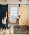 Woman painting Knotty Pine Barn Door 36 By 84 Inches Unfinished Solid Wood with sliding hardware kit, in a rustic bathroom setting.
