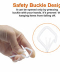 Close-up of hand holding white screw hook showing safety buckle design from Heavy Duty Eye Screw Hooks With Safety Buckle 35 Piece Set