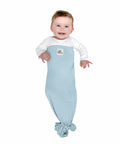 Baby wearing adjustable baby swaddle for newborns that feels like the womb pediatrician recommended safe sleep solution