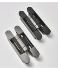 Real Quick And Easy Concealed Hydraulic Hinge With Three Way Tweaks And Silky Soft Close Action Swinging Up To Two Hundred Pounds For Smooth Flush Kitchen Doors In Heavy Duty Black, displaying two sleek black hydraulic hinges.