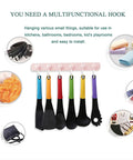 Kids Room Wall Mount Coat Rack With Six Rotating Adhesive Hooks for hanging kitchen tools and towels, displayed in use.