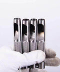 Pro Grade Leather Punch Set With Steel Hollow Punches held in a gloved hand, showcasing durable steel build and texture.