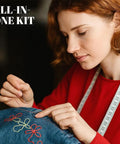 Person sewing fabric with 37 Piece Big Eye Stainless Steel Sewing Needles Kit for Handy Hand Sewing and Leather Repairs.