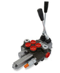 Front view of a two-spool monoblock hydraulic directional control valve with red port caps and two black levers.