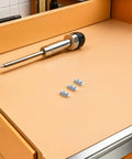 50 Pcs Premium M5 Cross Dowel Nuts Silver Carbon Steel Barrel Nut Connector Hardware on workbench with screwdriver.