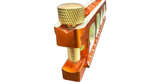 Close-up of Savage Magnetic Billet Torpedo Level With Brass Pipe Clamp, 6 Inch Precision Tool For Framing And Rough Ins