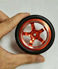 Close-up of Drift Ready CNC Metal Wheels With 65mm Drift Tires And 12mm Hex Hub For One Tenth Scale RC Cars Upgrade Parts Kit