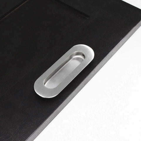 Stainless Steel Oval Recessed Sliding Door Flush Pull Handle 120mm By 40mm Brushed Satin Nickel Finish shown on dark door